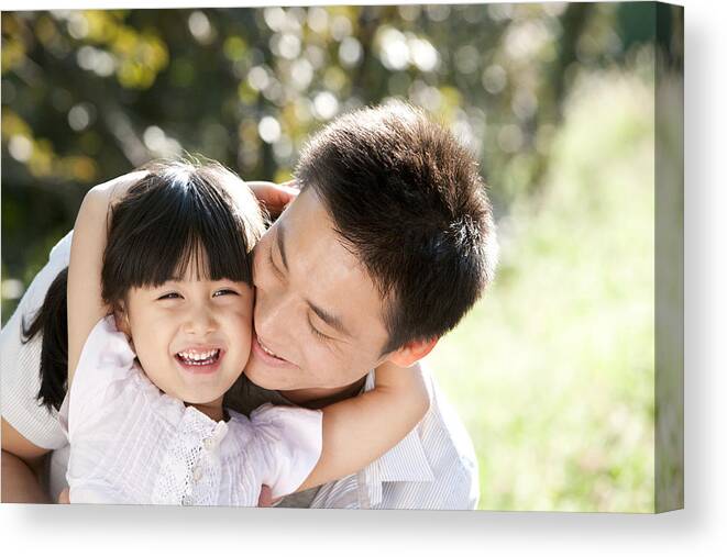 Young Men Canvas Print featuring the photograph Young father and daughter outdoors by Lane Oatey/Blue Jean Images
