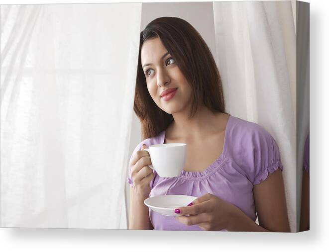 People Canvas Print featuring the photograph Young woman with a cup of coffee by Ravi Ranjan