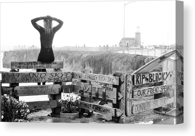Black White santa Cruz Surfer Girl Woman Lighthouse Coast California Shore Fence Memorial Mournful Blackies Canvas Print featuring the photograph After the Storm by Nahed Hamdi by California Coastal Commission