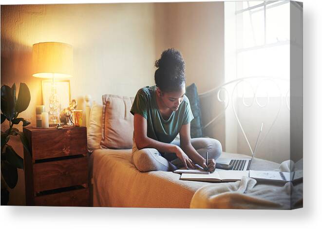 Internet Canvas Print featuring the photograph She's a diligent student by PeopleImages