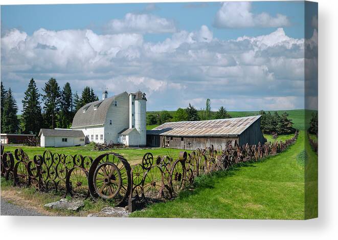 Agriculture Canvas Print featuring the photograph An art of a wagonwheel. by Usha Peddamatham