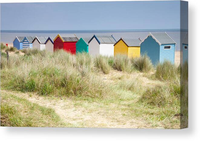 Beach Canvas Print featuring the photograph Beach huts by Ian Merton