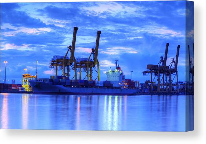 Bangkok Canvas Print featuring the photograph Container Cargo freight ship with working crane bridge in shipya by Anek Suwannaphoom