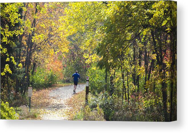 Digital Canvas Print featuring the photograph Jogger on Nature Trail in Autumn by Lynn Hansen