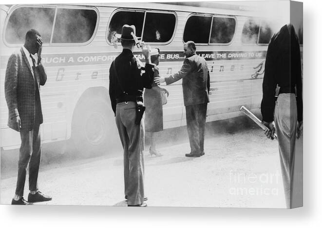 People Canvas Print featuring the photograph Burning Bus After Attack by Bettmann