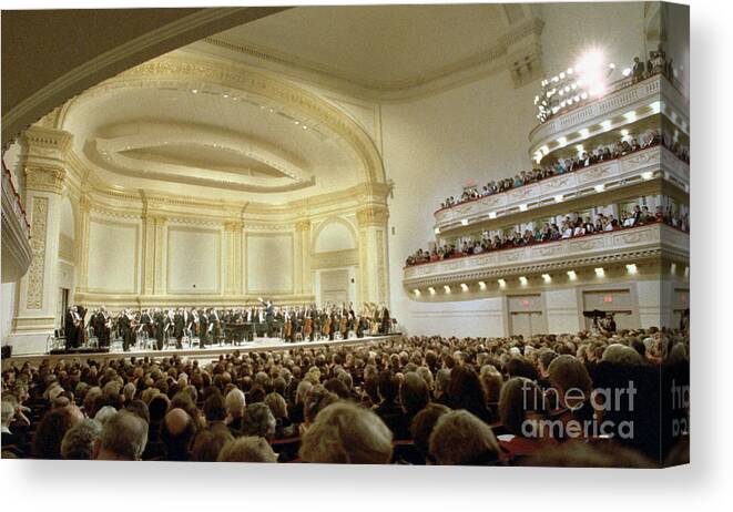 1980-1989 Canvas Print featuring the photograph New York Philharmonic At Carnegie Hall by Bettmann