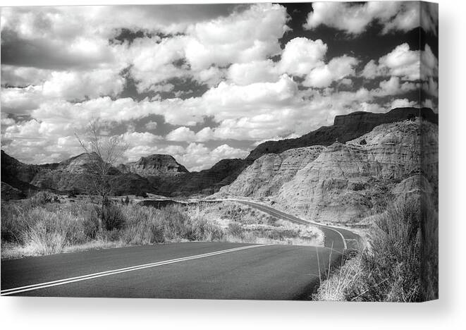 Dramatic Badlands Road Canvas Print featuring the photograph Dramatic Badlands Road by Dan Sproul