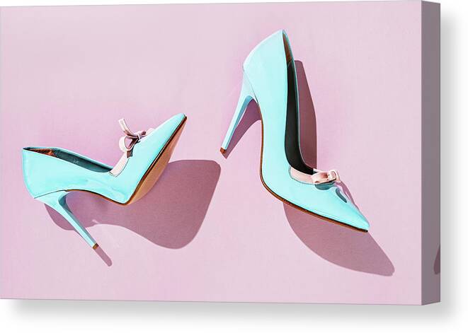 Pare of light blue high heel shoes on pink background with shado Canvas  Print / Canvas Art by Elena Seychelles - Pixels