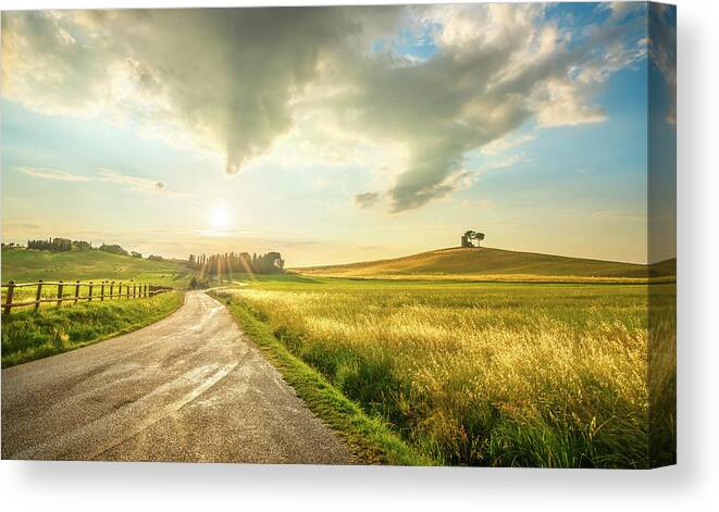 Tuscany Canvas Print featuring the photograph Sunset landscape in Alta Maremma. by Stefano Orazzini