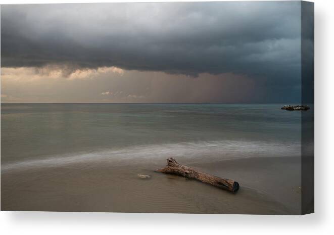 Storm Canvas Print featuring the photograph The coming of the storm from ocean by Michalakis Ppalis