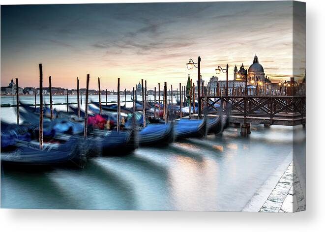 Gondola Canvas Print featuring the photograph Venice Gondolas moored at the San Marco square. by Michalakis Ppalis