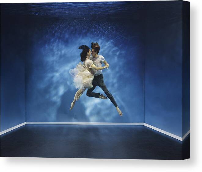 Tranquility Canvas Print featuring the photograph A couple dancing under water by Henrik Sorensen