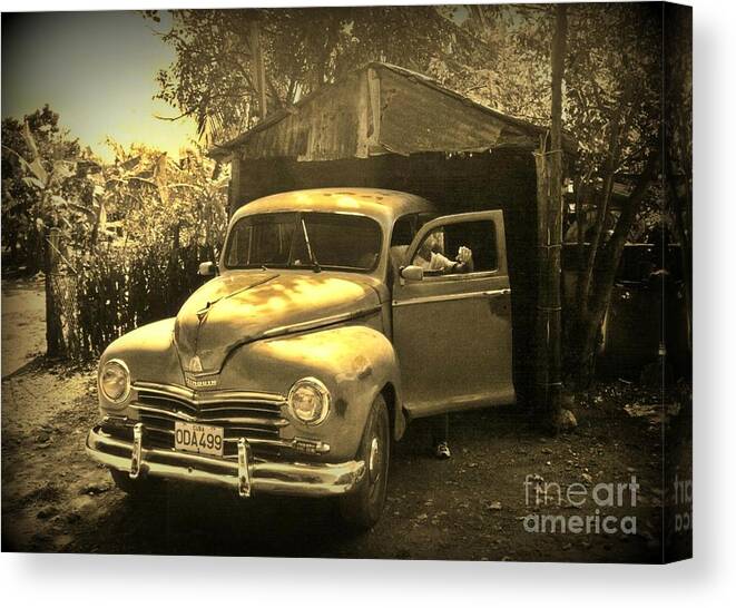 Antique Cars Canvas Print featuring the photograph An Old Hidden Gem by John Malone