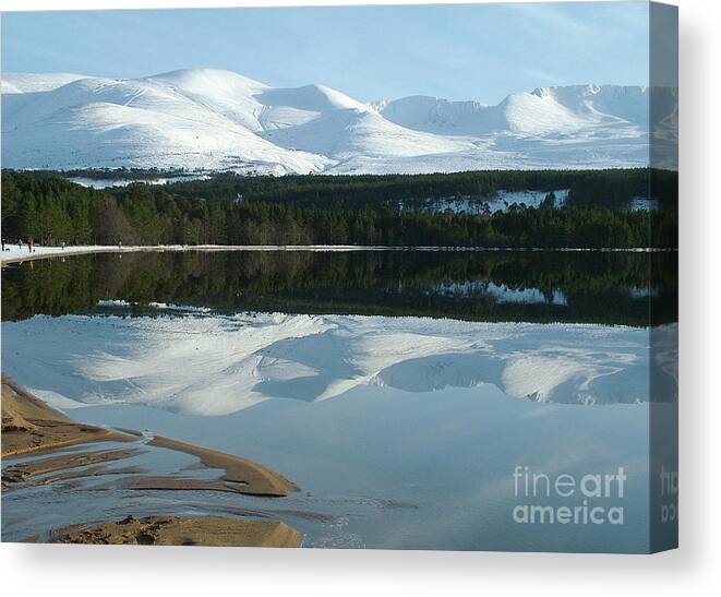 Loch Morllch Canvas Print featuring the photograph Loch Morlich and Cairngorm - Winter Reflections by Phil Banks