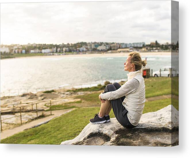 Mature Adult Canvas Print featuring the photograph Mature woman enjoying the ocean view Sydney Australia by OwenPrice