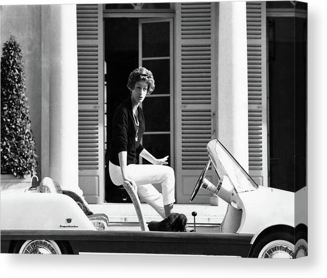 Automobile Canvas Print featuring the photograph Signora Giovanni Agnelli Getting Into Her Small by Henry Clarke