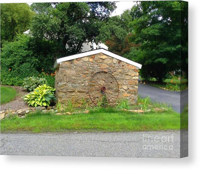 Stonewall Canvas Print featuring the photograph Stone Well Cover and Wheel by Becky Lupe