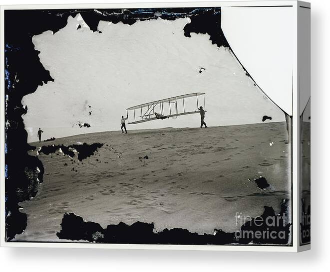 The Wright Brothers Canvas Print featuring the photograph The Wright Brothers Wilbur in motion at left holding one end of glider by Vintage Collectables