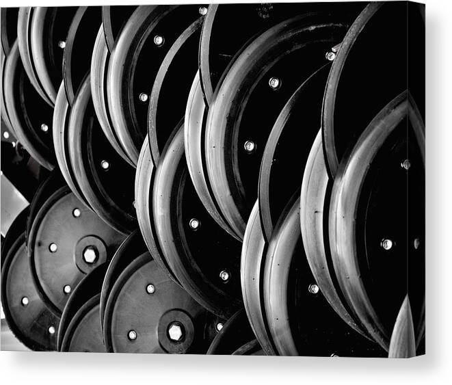 Black Canvas Print featuring the photograph Plow Wheels by Kevin Duke
