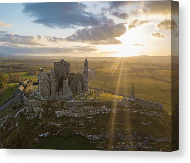 Castle Canvas Print featuring the photograph The Famous Ireland Castle rock Of Cashel On A Sunset #1 by Cavan Images