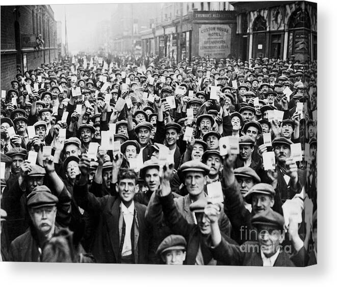 Employment And Labor Canvas Print featuring the photograph Crowd Of Dock Workers Holding Up Cards by Bettmann