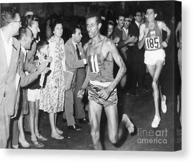 Abebe Bikila Canvas Print featuring the photograph Ethiopian Runner Abebe Bikila Winning by Bettmann