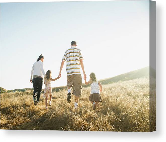 4-5 Years Canvas Print featuring the photograph Family Walking Together In Rural Field by Erik Isakson