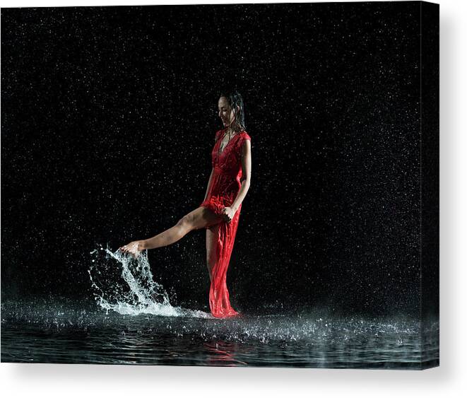 People Canvas Print featuring the photograph Female In Red, Foot Splashing In Water by Jonathan Knowles