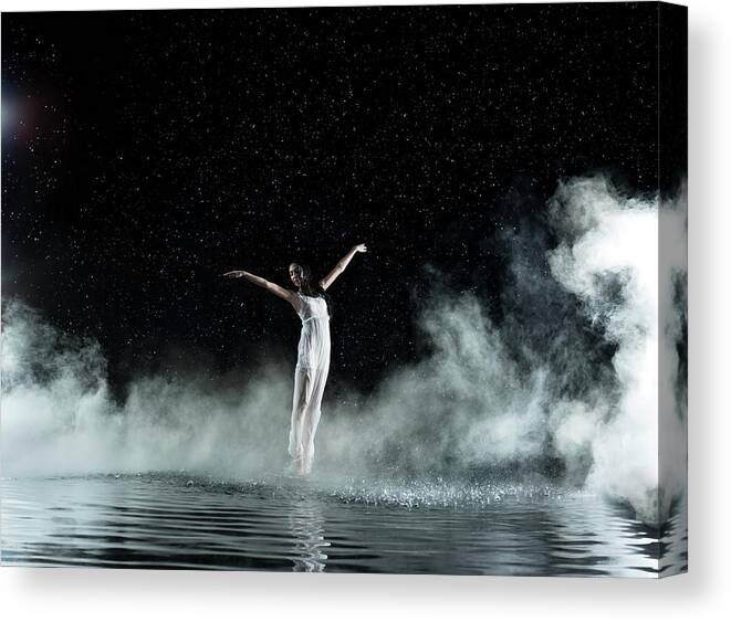 People Canvas Print featuring the photograph Female In White Dancing, Rainy Night by Jonathan Knowles