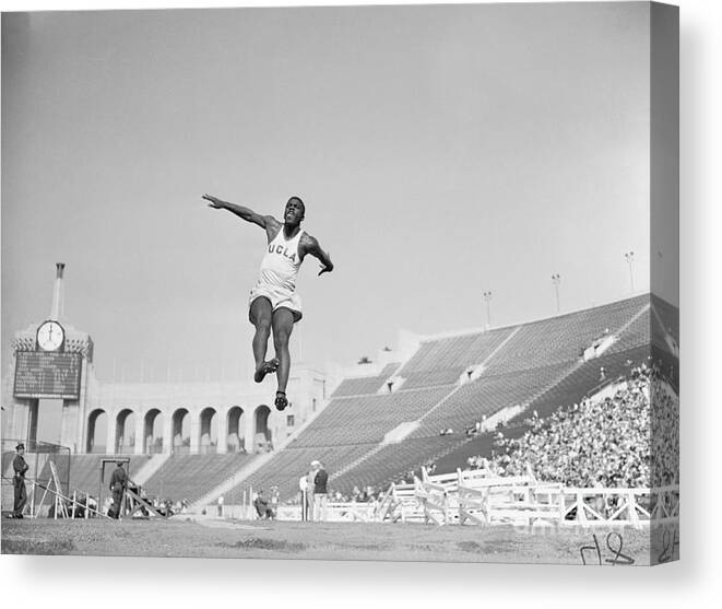 Wind Canvas Print featuring the photograph Jackie Robinson At A Track Meet by Bettmann