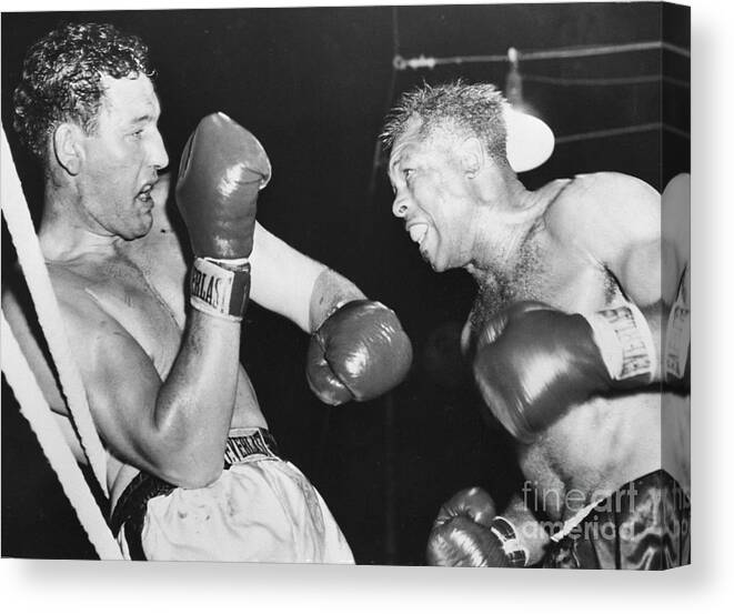People Canvas Print featuring the photograph James Parker Blocking Archie Moore Punch by Bettmann
