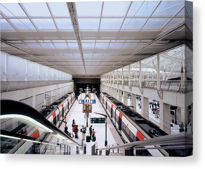 Train Canvas Print featuring the photograph Travelers Changing Trains At Charles De by Eschcollection