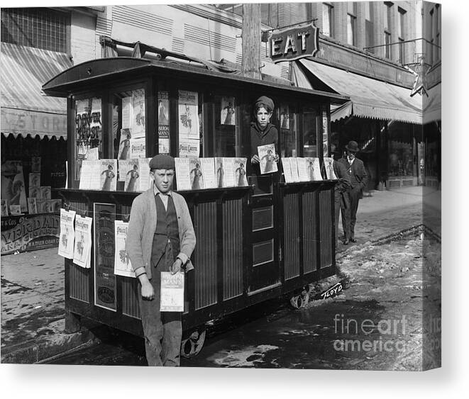 People Canvas Print featuring the photograph Two Boys Holding Magazines At Newsstand by Bettmann