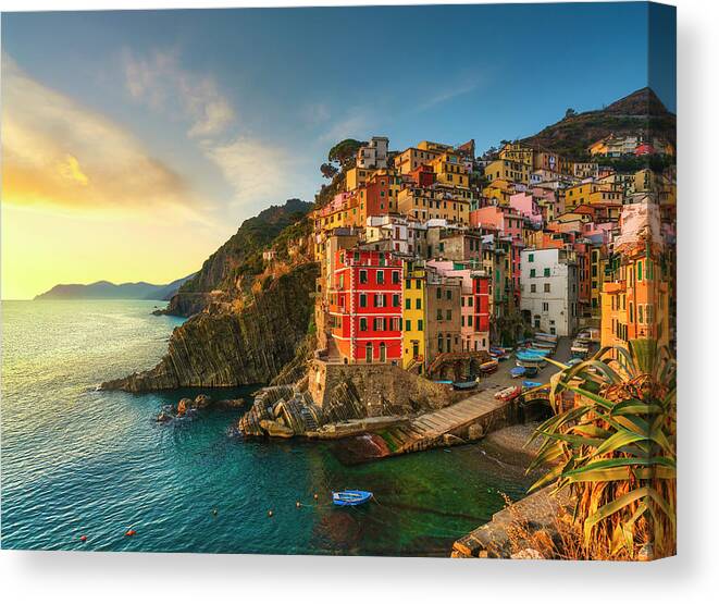 Riomaggiore Canvas Print featuring the photograph Riomaggiore town, cape and sea landscape at sunset. Cinque Terre #4 by Stefano Orazzini