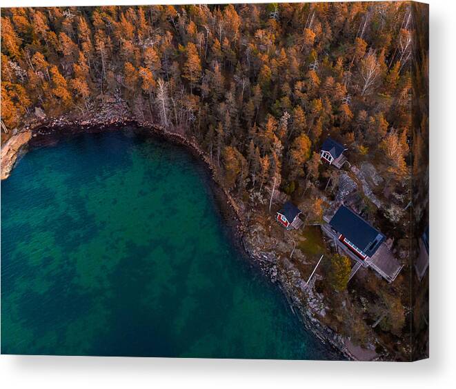 Natural Pattern Canvas Print featuring the photograph Aerial view of red houses with the sea and nature in the Stockholm archipelago. by Artur Debat