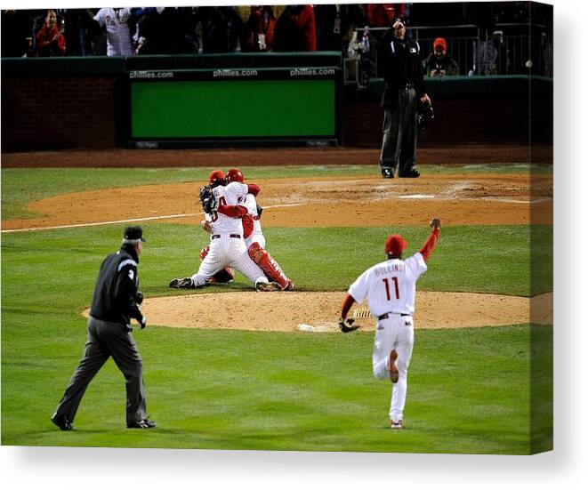 Baseball Catcher Canvas Print featuring the photograph Carlos Ruiz, Brad Lidge, and Jimmy Rollins by Jeff Zelevansky