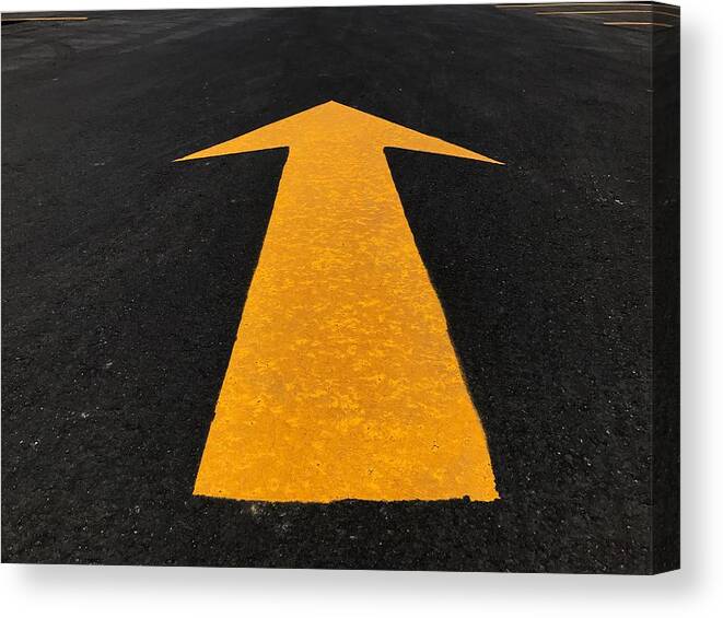 Outdoors Canvas Print featuring the photograph Close-Up Of Arrow Sign On Road by Ryan Chen / EyeEm