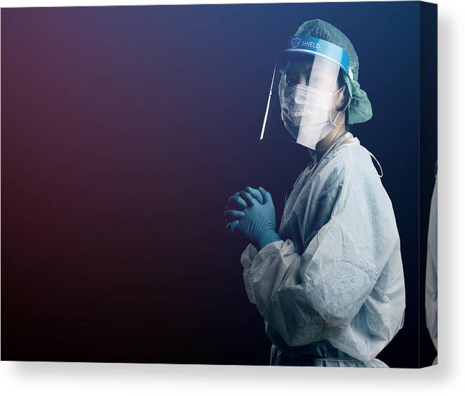 Expertise Canvas Print featuring the photograph doctor in PPE suit uniform has stress and pray in Coronavirus outbreak or Covid-19, Concept of Covid-19 quarantine.Emotional stress of overworked doctor and medical care team during covid-10 period. by Skaman306