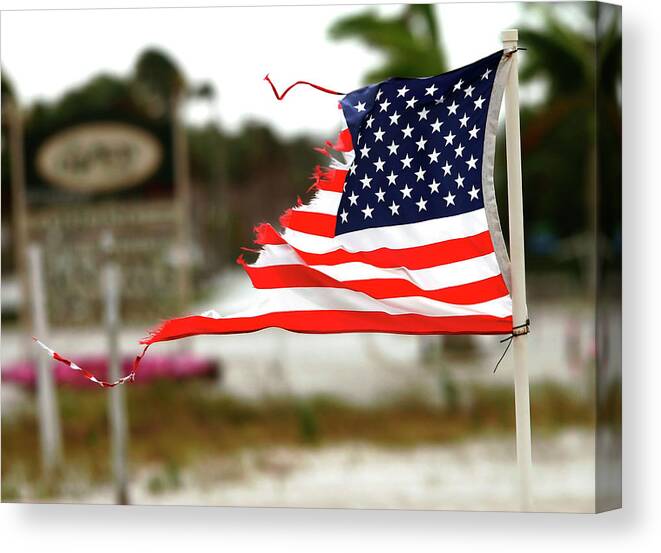 Hurricane Canvas Print featuring the photograph U.S. Flag damaged by Hurricane by Rick Wilking