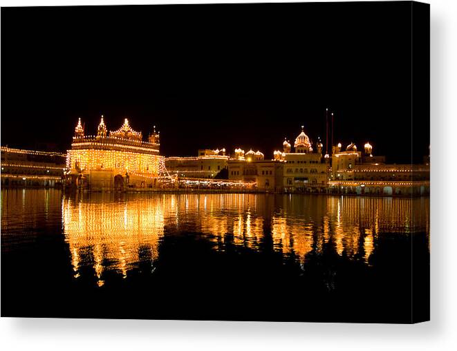 Golden Temple Canvas Print featuring the photograph At night #1 by Devinder Sangha