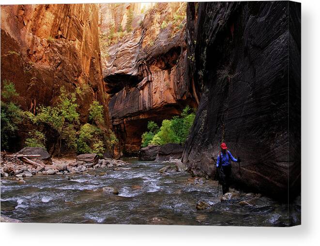 Adventure Canvas Print featuring the photograph A Woman Hikes Through A River Bed #12 by Rich Wheater
