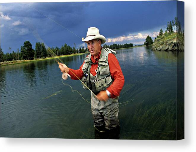 A Man In A Cowboy Hat Fly Fishing Canvas Print / Canvas Art by