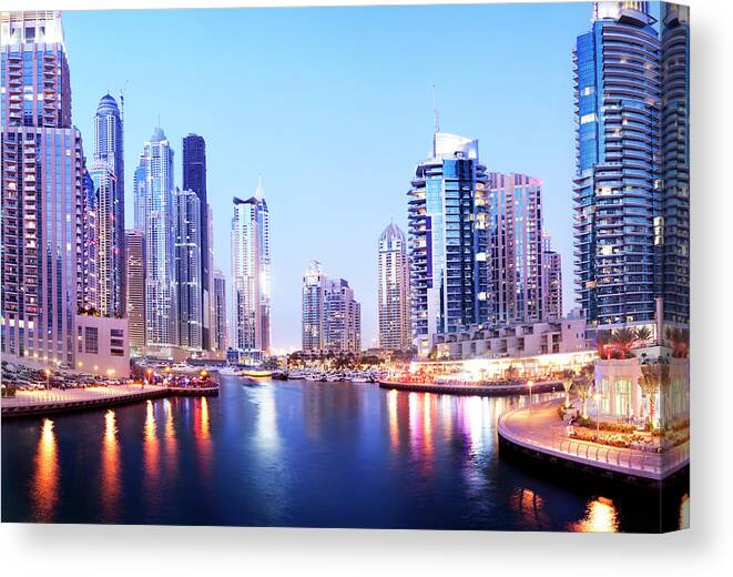 Built Structure Canvas Print featuring the photograph Dubai Marina Skyline At Night In The by Deejpilot