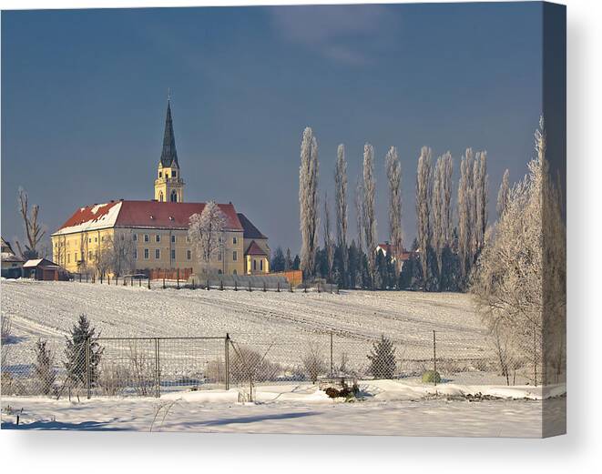 Krizevci Canvas Print featuring the photograph Greek catholic cathedral in snow landscape by Brch Photography