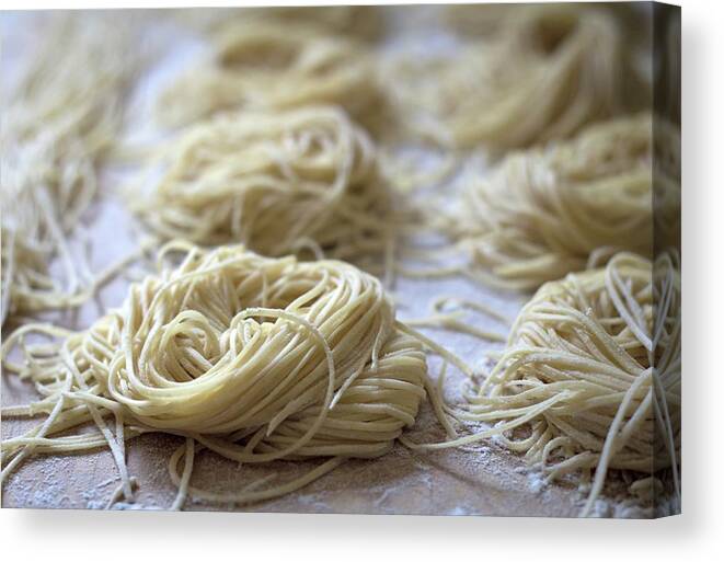 In A Row Canvas Print featuring the photograph Homemade Pasta by © 2011 Staci Kennelly