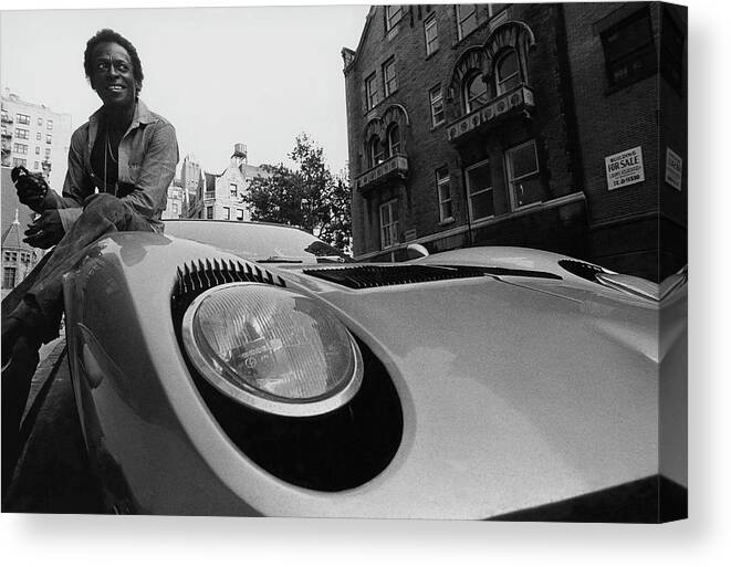 Music Canvas Print featuring the photograph Jazz Musician Miles Davis Sitting On The Hood by Mark Patiky