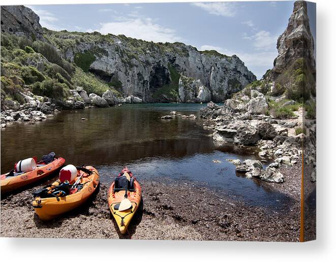 Blue Canvas Print featuring the photograph Kayak time - The Landscape of Cales Coves Menorca is a great place for peace and sport by Pedro Cardona Llambias