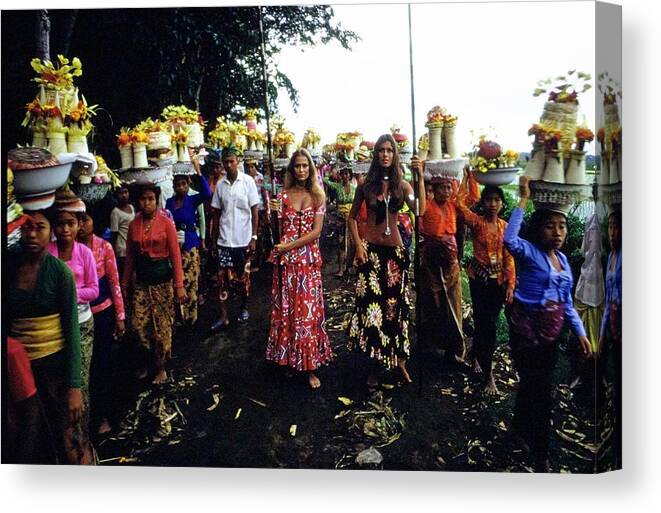 Fashion Canvas Print featuring the photograph Models During Procession In Bali by Arnaud de Rosnay