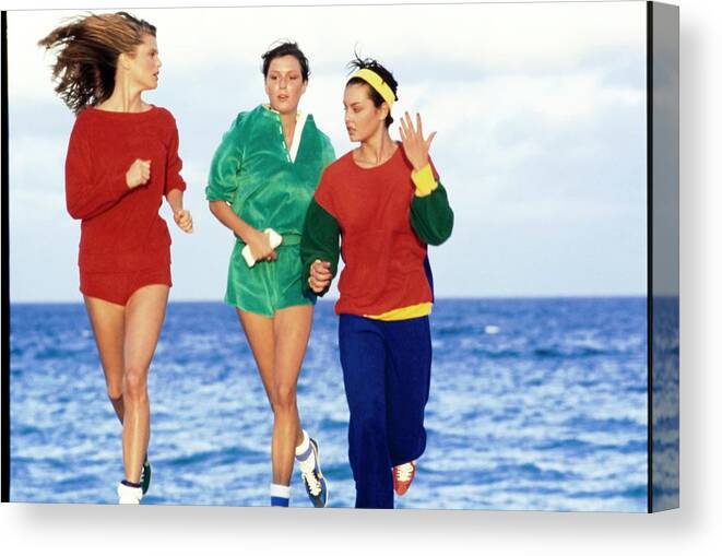 Exterior Canvas Print featuring the photograph Models Wearing Sportswear On A Beach by Arthur Elgort