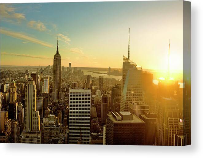 Downtown District Canvas Print featuring the photograph New York City At Sunset by Aluxum